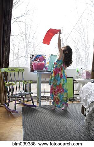 Caucasian girl playing in bedroom View Large Photo Image Stock Photo - Caucasian girl playing in bedroom. Fotosearch
