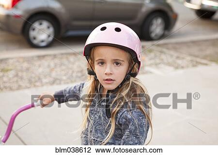 Caucasian girl riding bicycle on sidewalk View Large Photo Image Stock Image - Caucasian girl riding bicycle on sidewalk. Fotosearch