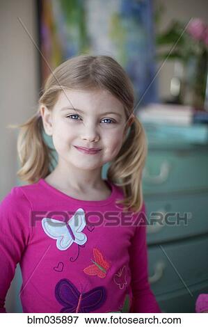 Caucasian girl smiling in bedroom View Large Photo Image Stock Photo - Caucasian girl smiling in bedroom. Fotosearch