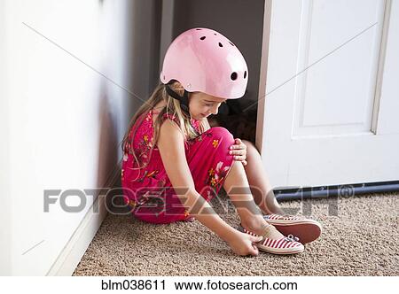 Caucasian girl wearing bike helmet in doorway View Large Photo Image Stock Image - Caucasian girl wearing bike helmet in doorway. Fotosearch