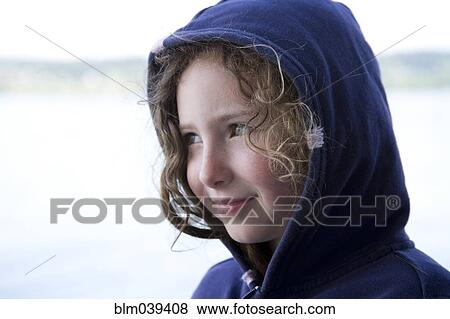 Caucasian girl wearing hood outdoors View Large Photo Image Stock Photo - Caucasian girl wearing hood outdoors. Fotosearch