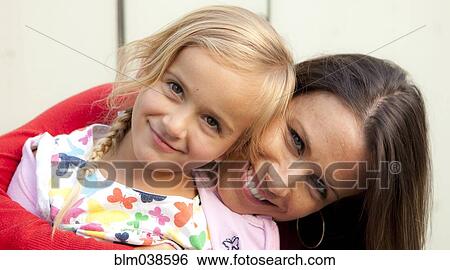 Caucasian mother and daughter smiling outdoors View Large Photo Image Stock Photograph - Caucasian mother and daughter smiling outdoors. Fotosearch