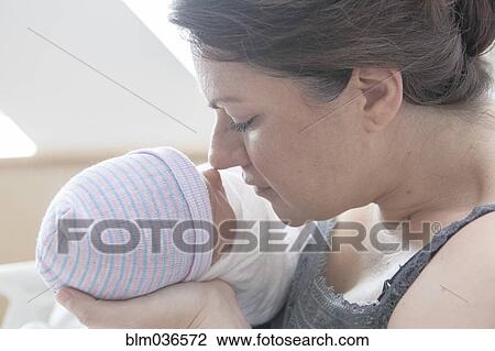 Caucasian mother rubbing noses with newborn daughter View Large Photo Image Stock Image - Caucasian mother rubbing noses with newborn daughter. Fotosearch
