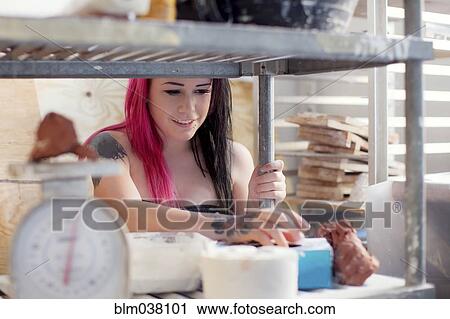 Stock Image - Caucasian sous chef cooking in kitchen. Fotosearch