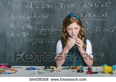 Caucasian student building vehicle in science class View Large Photo Image Stock Photo - Caucasian student building vehicle in science class. Fotosearch