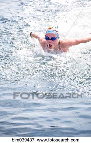 Caucasian swimmer gasping for air in lake View Large Photo Image Stock Photo - Caucasian swimmer gasping for air in lake. Fotosearch