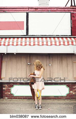 Caucasian teenage girl standing outside pizzeria View Large Photo Image Stock Photo - Caucasian teenage girl standing outside pizzeria. Fotosearch