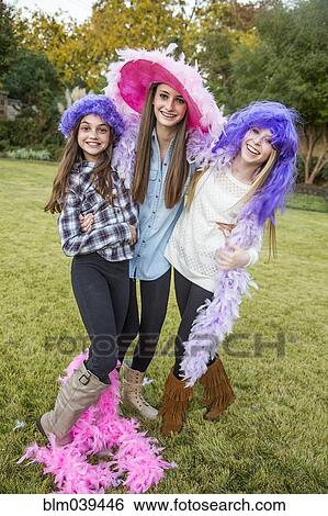 Caucasian teenage girls wearing feather boas and costumes View Large Photo Image Stock Photograph - Caucasian teenage girls wearing feather boas and costumes. Fotosearch