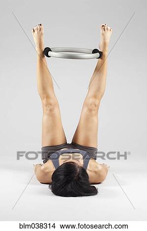 Caucasian woman exercising with resistance ring View Large Photo Image Picture - Caucasian woman exercising with resistance ring. Fotosearch
