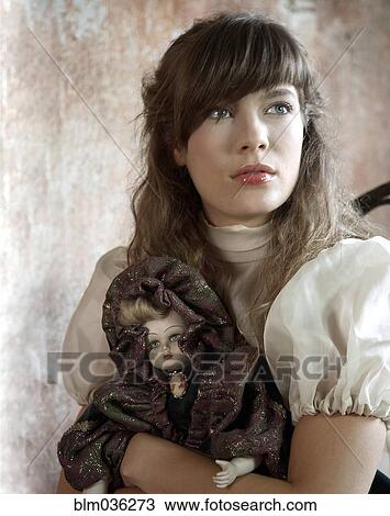 Caucasian woman holding porcelain doll View Large Photo Image Stock Image - Caucasian woman holding porcelain doll. Fotosearch