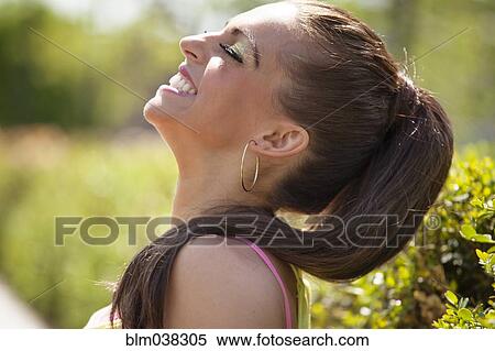 Caucasian woman laughing outdoors View Large Photo Image Stock Photography - Caucasian woman laughing outdoors. Fotosearch