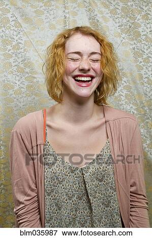 Caucasian woman laughing with eyes closed View Large Photo Image Stock Photo - Caucasian woman laughing with eyes closed. Fotosearch