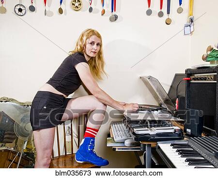 Caucasian woman playing record in living room View Large Photo Image Stock Image - Caucasian woman playing record in living room. Fotosearch