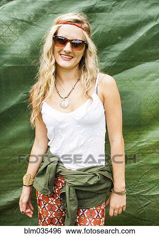 Caucasian woman smiling near tarp View Large Photo Image Stock Photograph - Caucasian woman smiling near tarp. Fotosearch