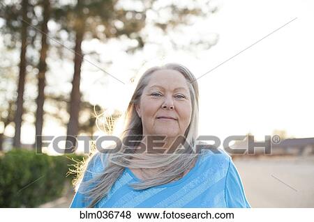 Caucasian woman smiling outdoors View Large Photo Image Stock Photo - Caucasian woman smiling outdoors. Fotosearch