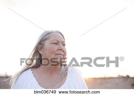 Caucasian woman smiling outdoors View Large Photo Image Stock Photo - Caucasian woman smiling outdoors. Fotosearch