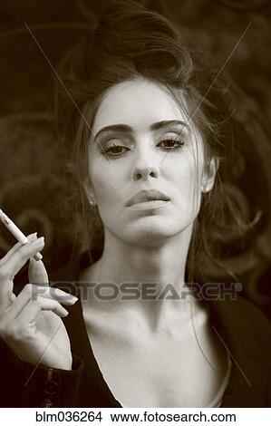 Caucasian woman smoking cigarette View Large Photo Image Picture - Caucasian woman smoking cigarette. Fotosearch