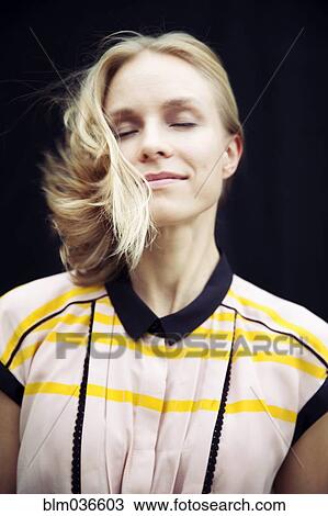 Caucasian woman tossing her hair View Large Photo Image Stock Image - Caucasian woman tossing her hair. Fotosearch