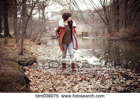 Caucasian woman walking near rural creek View Large Photo Image Stock Photography - Caucasian woman walking near rural creek. Fotosearch