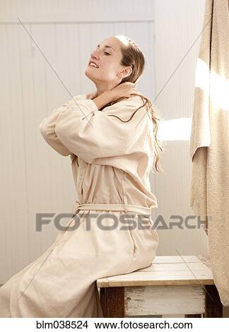 Caucasian woman wearing bathrobe in bathroom View Large Photo Image Picture - Caucasian woman wearing bathrobe in bathroom. Fotosearch