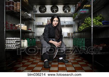Chef sitting in walk-in refrigerator in restaurant View Large Photo Image Picture - Chef sitting in walk-in refrigerator in restaurant. Fotosearch