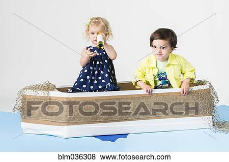 Children playing in cardboard boat View Large Photo Image Stock Photo - Children playing in cardboard boat. Fotosearch