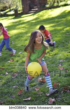 Children playing with ball in park View Large Photo Image Stock Image - Children playing with ball in park. Fotosearch