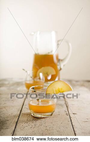 Close up of apple cider glass with garnish View Large Photo Image Picture - Close up of apple cider glass with garnish. Fotosearch