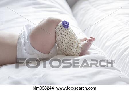 Close up of baby girl wearing leg warmer View Large Photo Image Picture - Close up of baby girl wearing leg warmer. Fotosearch