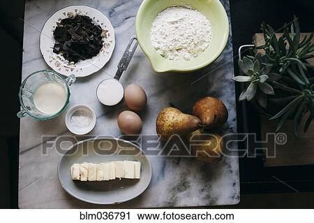 Close up of baking ingredients and pears on marble counter View Large Photo Image Stock Image - Close up of baking ingredients and pears on marble counter. Fotosearch