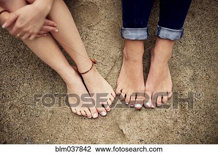 Close up of barefoot girls on rock View Large Photo Image Stock Image - Close up of barefoot girls on rock. Fotosearch