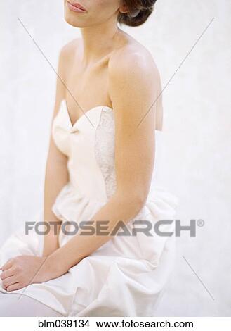 Picture - Close up of bride wearing wedding dress. Fotosearch