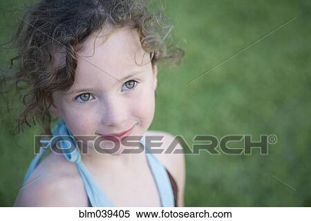 Stock Photography - Close up of Caucasian girl smiling outdoors. Fotosearch