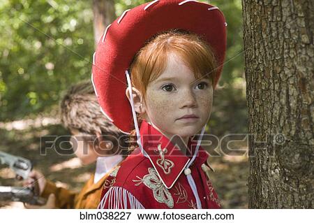 Close up of Caucasian girl wearing cowgirl costume View Large Photo Image Stock Photo - Close up of Caucasian girl wearing cowgirl costume. Fotosearch