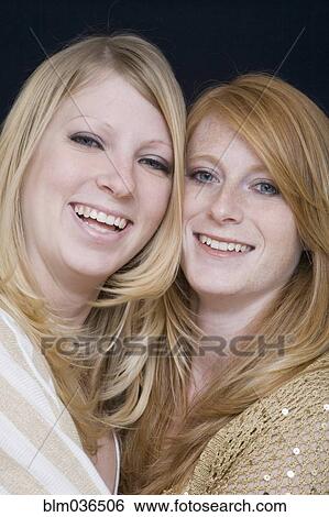 Close up of Caucasian sisters hugging View Large Photo Image Stock Photograph - Close up of Caucasian sisters hugging. Fotosearch