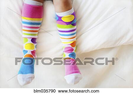 Close up of child wearing colorful socks View Large Photo Image Stock Image - Close up of child wearing colorful socks. Fotosearch