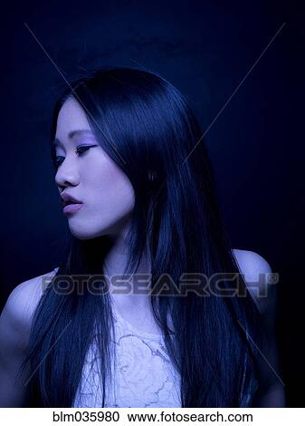 Stock Image - Close up of Chinese woman with long hair. Fotosearch