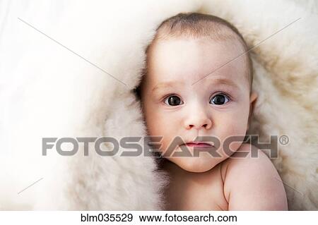 Stock Photo - Close up of curious mixed race baby. Fotosearch