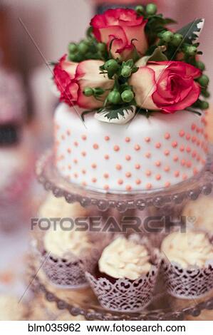 Close up of decorated cake and cupcakes View Large Photo Image Stock Image - Close up of decorated cake and cupcakes. Fotosearch