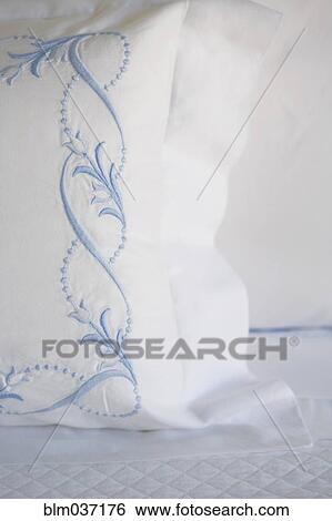 Stock Photograph - Close up of embroidery on pillow. Fotosearch
