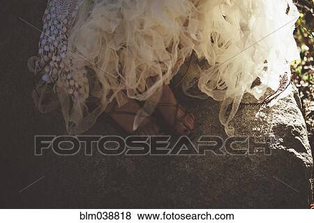 Close up of feet of bride wearing wedding gown and sandals View Large Photo Image Stock Photo - Close up of feet of bride wearing wedding gown and sandals. Fotosearch