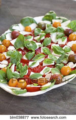 Stock Photo - Close up of fresh tomato and cheese salad. Fotosearch