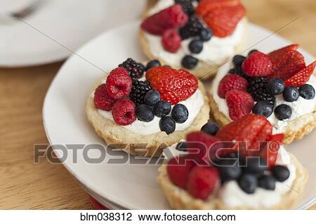 Close up of fruit and cream tarts View Large Photo Image Stock Image - Close up of fruit and cream tarts. Fotosearch