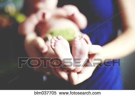 Close up of girl holding baby View Large Photo Image Stock Photography - Close up of girl holding baby. Fotosearch