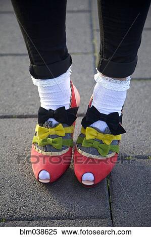Stock Photography - Close up of girl wearing bows on shoes. Fotosearch