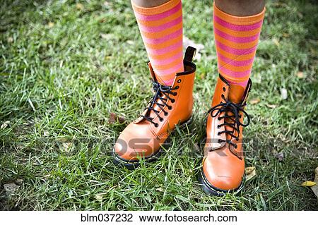 Close up of girl wearing colorful socks and boots View Large Photo Image Stock Image - Close up of girl wearing colorful socks and boots. Fotosearch