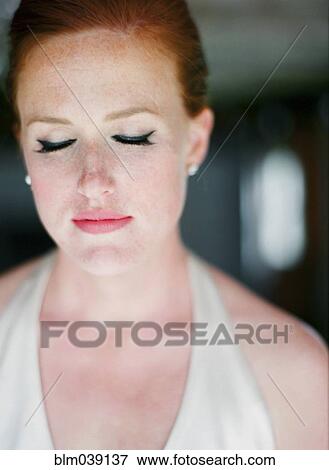 Stock Photo - Close up of glamorous bride with eyes closed. Fotosearch