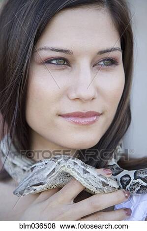 Close up of Hispanic woman with snake around her neck View Large Photo Image Stock Photo - Close up of Hispanic woman with snake around her neck. Fotosearch