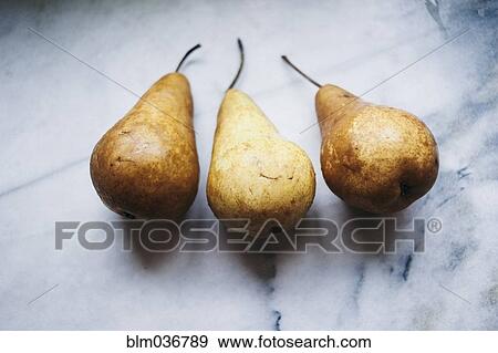 Close up of pears on marble counter View Large Photo Image Stock Photo - Close up of pears on marble counter. Fotosearch