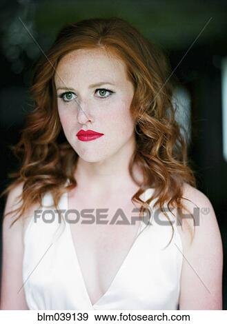 Stock Photo - Close up of serious bride in wedding dress. Fotosearch